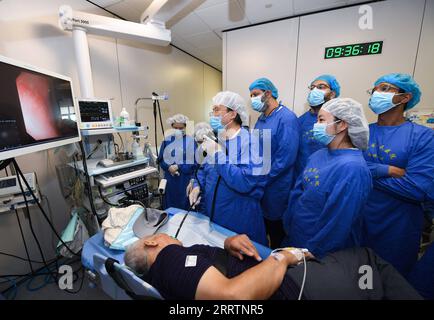 230803 -- NANJING, Aug. 3, 2023 -- Foreign medical workers of a medical seminar watch as Fan Zhining, expert of digestive endoscopy, performs an operation at digestive endoscopy center of Jiangsu Province Hospital in Nanjing, capital of east China s Jiangsu Province, Aug. 1, 2023. In recent years, Jiangsu Province Hospital cooperated with medical institutions in Pakistan, Egypt and other countries and regions in the field of digestive endoscopy to promote medical cooperation under the Belt and Road Initiative.  CHINA-JIANGSU-DIGESTIVE ENDOSCOPY-INTERNATIONAL COOPERATION CN JixChunpeng PUBLICAT Stock Photo