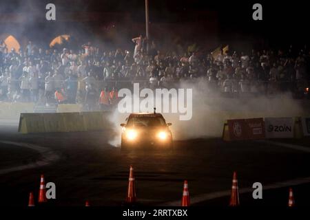 230812 -- DEAD SEA, Aug. 12, 2023 -- A competitor performs during the Red Bull Car Park Drift 2023 in the Dead Sea area, Jordan, on Aug. 11, 2023. Photo by /Xinhua SPJORDAN-DEAD SEA-CAR PARK DRIFT MohammadxAbuxGhosh PUBLICATIONxNOTxINxCHN Stock Photo