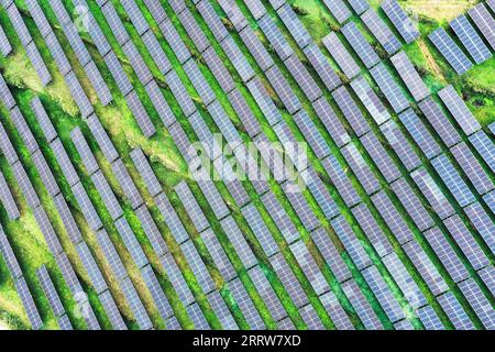 230815 -- GUIYANG, Aug. 15, 2023 -- This aerial photo taken on July 20, 2023 shows a photovoltaic power plant in Yi-Hui-Miao Autonomous County of Weining, southwest China s Guizhou Province. Guizhou has seized the opportunity and made big stride in the development of new energy industry, such as wind power and photovoltaic power, in recent years. While vigorously developing green energy, Guizhou has also made full use of the land under photovoltaic panels to develop farming and livestock breeding. By the end of June 2023, the total installed capacity of new energy in Guizhou had reached 21.81 Stock Photo