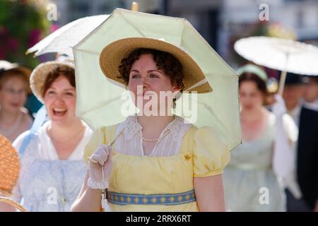 Bath, UK. 9th Sep, 2023. Jane Austen fans are pictured taking part in the world famous Grand Regency Costumed Promenade. The Promenade, part of the Jane Austen Festival is a procession through the streets of Bath and the participants who come from all over the world dress in 18th Century costume. Credit: Lynchpics/Alamy Live News Stock Photo