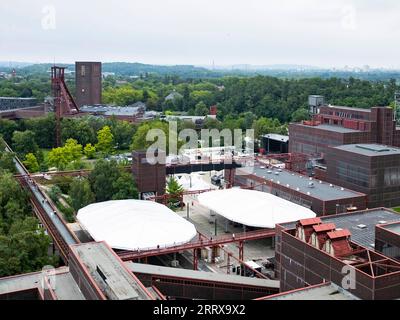 230830 -- FRANKFURT, Aug. 30, 2023 -- Buildings are seen at the Zollverein coal mine industrial complex in Essen, Germany, Aug. 16, 2023. From the Ruhr area in Germany to the Shougang industrial park in Beijing, one after another steel giants stand as witnesses to the development process of human civilization. The Ruhr area in Germany is a significant industrial zone in Europe, once a coal and steel production hub for Germany. The Zollverein coal mine industrial complex in Essen was one of the world s largest coal mines from the late 19th to the early 20th century. With Germany s transition in Stock Photo