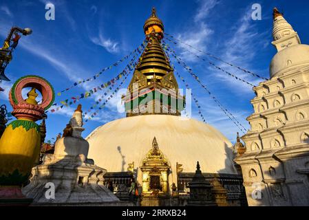 Strolling around the Swayambhunath stupa and smaller pagodas in Swayambhu Temple, Kathmandu, Nepal, around sunset on a quiet afternoon in winter Stock Photo