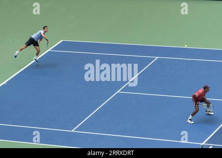 Joe Salisbury of United Kingdom and Rajeev Ram of USA in action during mens doubles final at the US Open Championships at Billie Jean King Tennis Center in New York on September 8, 2023 Stock Photo