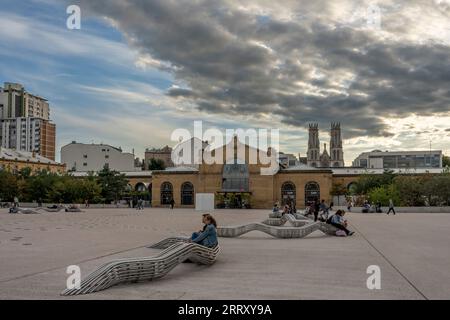 Nancy, France - 09 01 2023: View of the facade of Nancy train station building, the square with metal benches and the towers of the Saint-Leon church Stock Photo