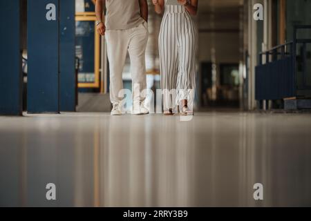 A confident, focused team of businesspeople analyzing financial reports and discussing strategies for successful project development both indoors and Stock Photo