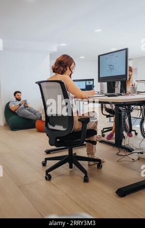 Efficient Team Analyzing Reports in Creative Business Office. Stock Photo