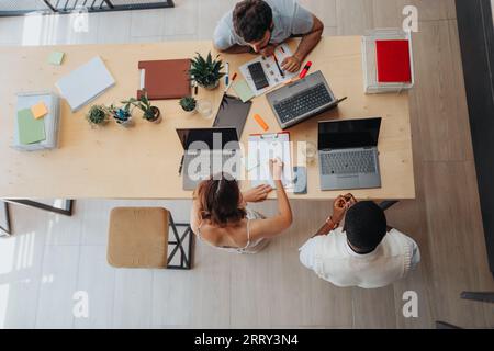 Focused Business Group Working Together in Modern Office Room Stock Photo