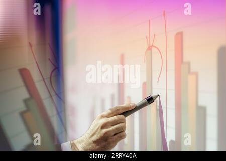University professor writing on smart board during classes Stock Photo