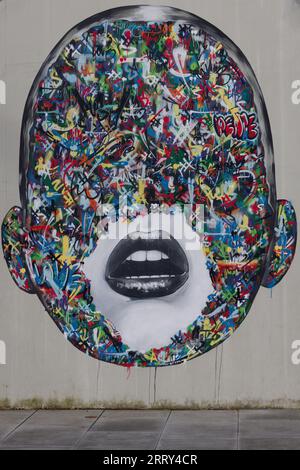 Mosaic face artistically painted on a wall in Norway Stock Photo