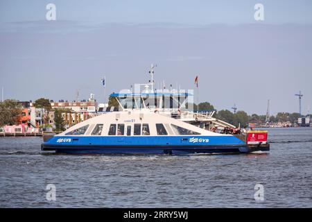 City ferry in Amsterdam over the IJ Water. These ferries runned bij GVB and are for pedestrians and cyclist. Access is free of charge Stock Photo