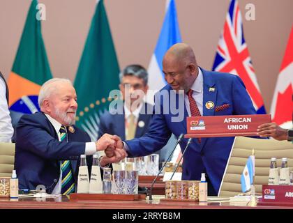 New Delhi, India. 09th Sep, 2023. Brazilian President Luiz Inacio Lula da Silva, left, congratulates African Union Chairman Azali Assoumani, right, after he was seated as a permanent member of the Group of Twenty members during the G20 Summit at the Bharat Mandapam convention center, September 9, 2023 in New Delhi, India. Credit: Ricardo Stuckert/Brazil Presidency/Alamy Live News Stock Photo