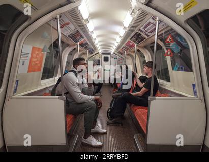 Passengers on the Glasgow SPT subway showing the longitudinal seating Stock Photo