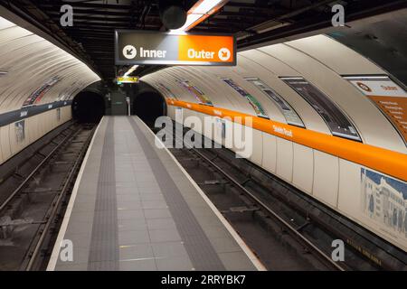 Shields road station on the Glasgow subway showing the narrow empty island platform with no passengers Stock Photo