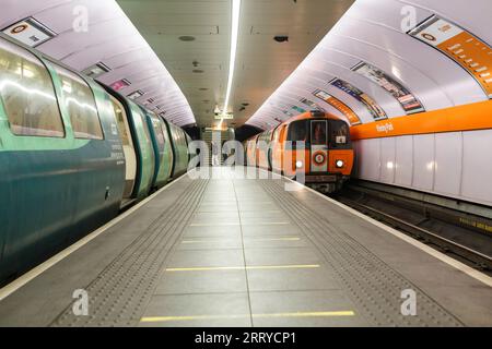 SPT subway train arriving at Glasgow Kinning Park Subway station on the Glasgow underground / subway Stock Photo