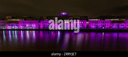 Leith, Edinburgh, Scotland, UK, 09 September 2023, Victoria Quay Lights Up: the Scottish Government building at Victoria Quay is one of a number of buildings lit up in pink light during the night in celebration of the Edinburgh Moonwalk which is taking place during the night. Credit: Sally Anderson/Alamy Live News Stock Photo