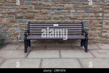 Bench in memory of Desmond Ackner QC at  Pantglas junior school memorial garden, Aberfan Stock Photo