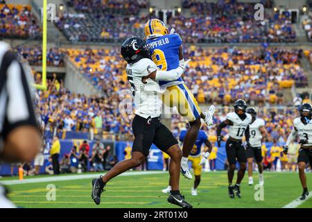 Pittsburgh, Pennsylvania, USA. 09th Sep, 2023. Pitt Panthers wide receiver Konata Mumpfield (9) catches a touchdown pass against Cincinnati Bearcats defensive back Taj Ward (15) during the 1st half of the NCAA football game between the Pitt Panthers and the Cincinnati Bearcats at Acrisure Stadium in Pittsburgh, Pennsylvania. Brent Gudenschwager/CSM/Alamy Live News Stock Photo