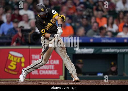 San Diego Padres' Matthew Batten, right, is tagged out by Philadelphia  Phillies second baseman Edmundo Sosa after trying to steal second during  the fifth inning of the first baseball game in a