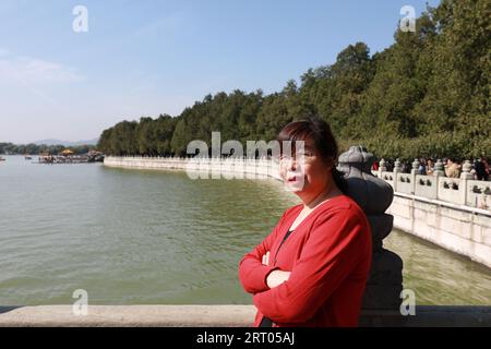 Beijing, China - October 6, 2020: A lady is playing in the summer palace Stock Photo