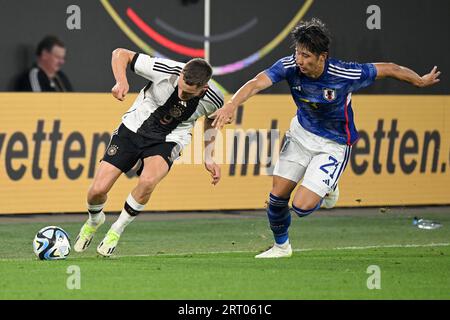 Frankfurt, Germany. 9th Sep, 2023. Florian Wirtz (L) of Germany vies with Ito Hiroki of Japan during a friendly match between Germany and Japan in Wolfsburg, Germany, Sept. 9, 2023. Credit: Ulrich Hufnagel/Xinhua/Alamy Live News Stock Photo