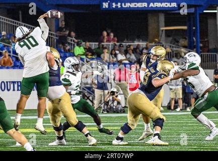 ANNAPOLIS, MD - SEPTEMBER 09: Wagner Seahawks quarterback Steven Krajewski  (8) is pressured by safety Rayuan Lane III (18) during the Wagner Seahawks  game versus the Naval Academy Midshipmen on September 9