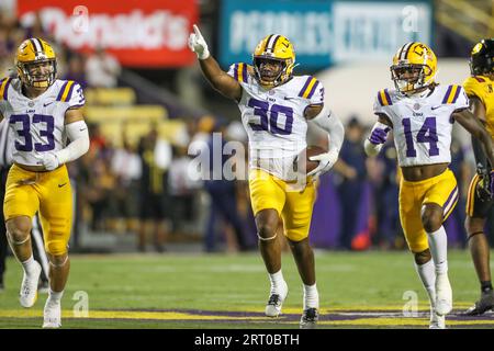 Baton Rouge, LA, USA. 09th Sep, 2023. LSU linebacker Greg Penn III (30) celebrates with teammates West Weeks (33) and Andre' Sam (14) after an interception during NCAA football game action between the Grambling State Tigers and the LSU Tigers at Tiger Stadium in Baton Rouge, LA. Jonathan Mailhes/CSM (Credit Image: © Jonathan Mailhes/Cal Sport Media). Credit: csm/Alamy Live News Stock Photo