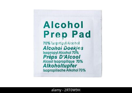 Disposable alcohol wipe for degreasing surfaces of parts to be glued in paper packaging isolated on white Stock Photo