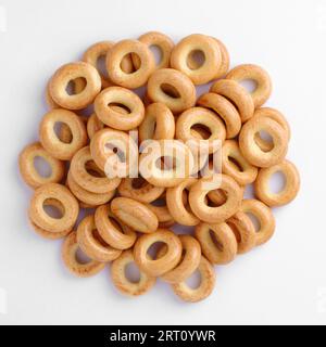Drying or mini bagels close-up on a white background, top view Stock Photo
