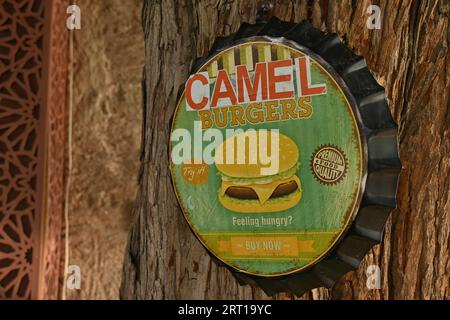 The shop sign of a restaurant selling camel burgers in Deira, a historically significant district in Dubai, United Arab Emirates Stock Photo