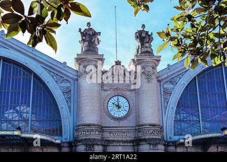 Tours, France - September 4, 2023: Cloe view of the architecture canopies and allegorical limestone statues of the Train Station Gare SNCF de Tours, co Stock Photo