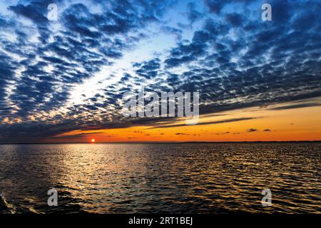 Glowing sunset over the Wadden Sea between Borkum and Juist, East Frisia, Germany Stock Photo