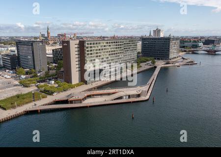 Copenhagen, Denmark, August 20, 2021: Aerial drone view of Kalvebod Wave, a wooden promenade at the harbour waterfront Stock Photo