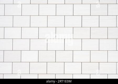 Background from a wall with rectangular white stone slabs Stock Photo