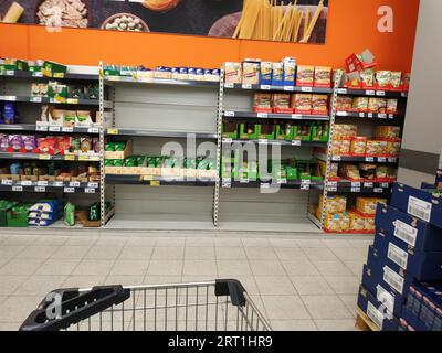 Rice shelves in a supermarket emptied by supply shortages and hoarding purchases Stock Photo