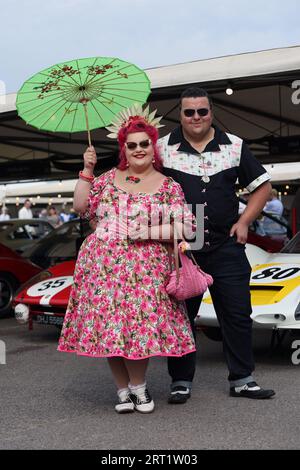 Visitors pose in vintage fashion at the Goodwood Revival at the Goodwood Motor Circuit in West Sussex. Picture date: Sunday September 10, 2023. Stock Photo