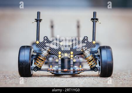 RC car chassis and parts being built to form a radio controlled race car Stock Photo