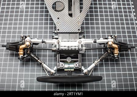 RC car chassis and parts being built to form a radio controlled race car Stock Photo