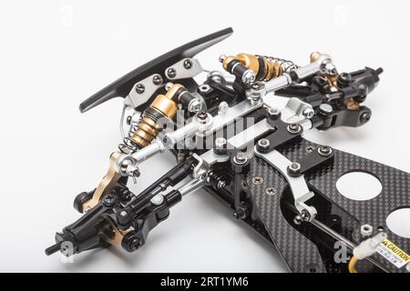 RC car chassis and parts being built to form a radio controlled race car Stock Photo