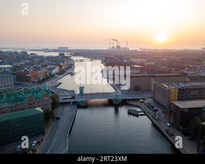 Copenhagen, Denmark, August 27, 2019: Aerial drone view of the Copenhagen harbor during sunrise Stock Photo