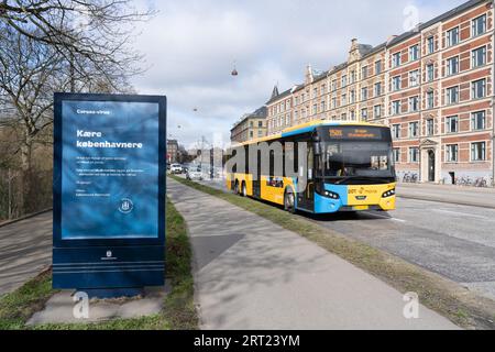 Copenhagen, Denmark, March 20, 2020: Advertisement board next to road displays information about the corona virus Stock Photo
