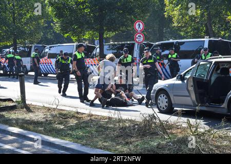 The Hague,The Netherlands, 10th september,2023. Extinction rebellion activists protested by blocking the A12 motorway again. A Watercannon was used and police removed and arrested hundreds of people.The protesters want to return every day to block the road.Credit:Pmvfoto/Alamy Live News Stock Photo