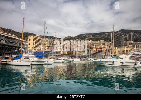 Monaco principality skyline as seen from Port Hercule, yachts and sailing boats on Mediterranean Sea Stock Photo