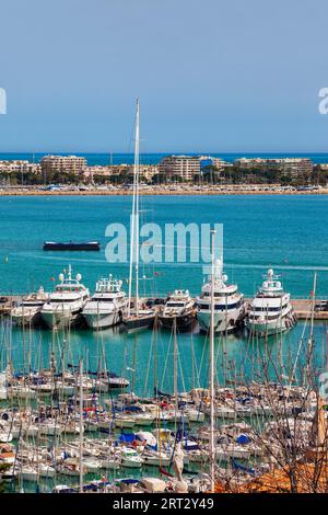 France, Port of Cannes, French Riviera, city skyline, yachts and sailing boats on Mediterranean Sea bay Stock Photo
