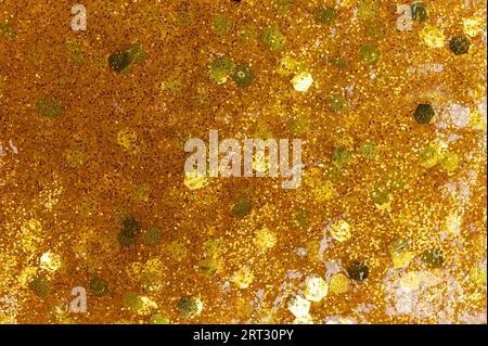 Surface of gold shiny color slime macro close up view Stock Photo