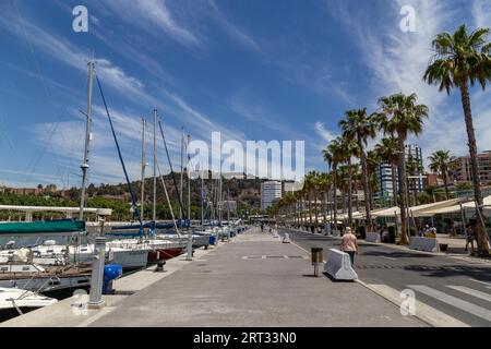 Malaga, Spain, May 24, 2019: Yachts and people at the Paseo del Muelle Uno, a beachfront shopping and leisure area Stock Photo