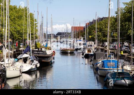 Copenhagen, Denmark, August 21, 2019: Tourist boat in a canal in Christianshavn district Stock Photo