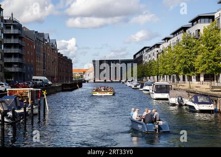 Copenhagen, Denmark, August 21, 2019: Tourist boat in a canal in Christianshavn district Stock Photo