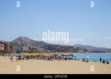 Malaga, Spain, May 25, 2019: People enjoying the sun at the beach La Malagueta Stock Photo