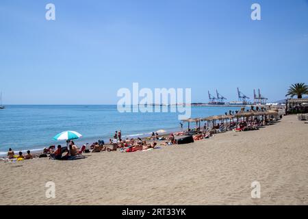 Malaga, Spain, May 25, 2019: People enjoying the sun at the beach La Malagueta Stock Photo