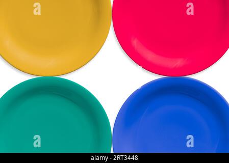 Colorful empty ceramic round plate isolated on white background Stock Photo